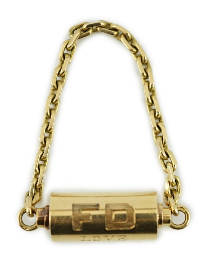 A mid to late 20th century Cartier 18ct gold barrel shaped key ring, with suspension chain